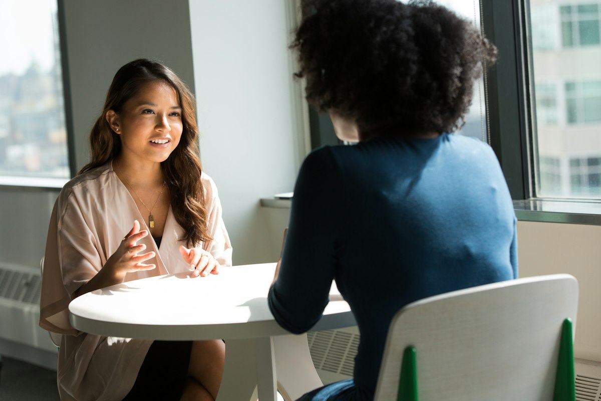 Two women in a one-to-one conversation